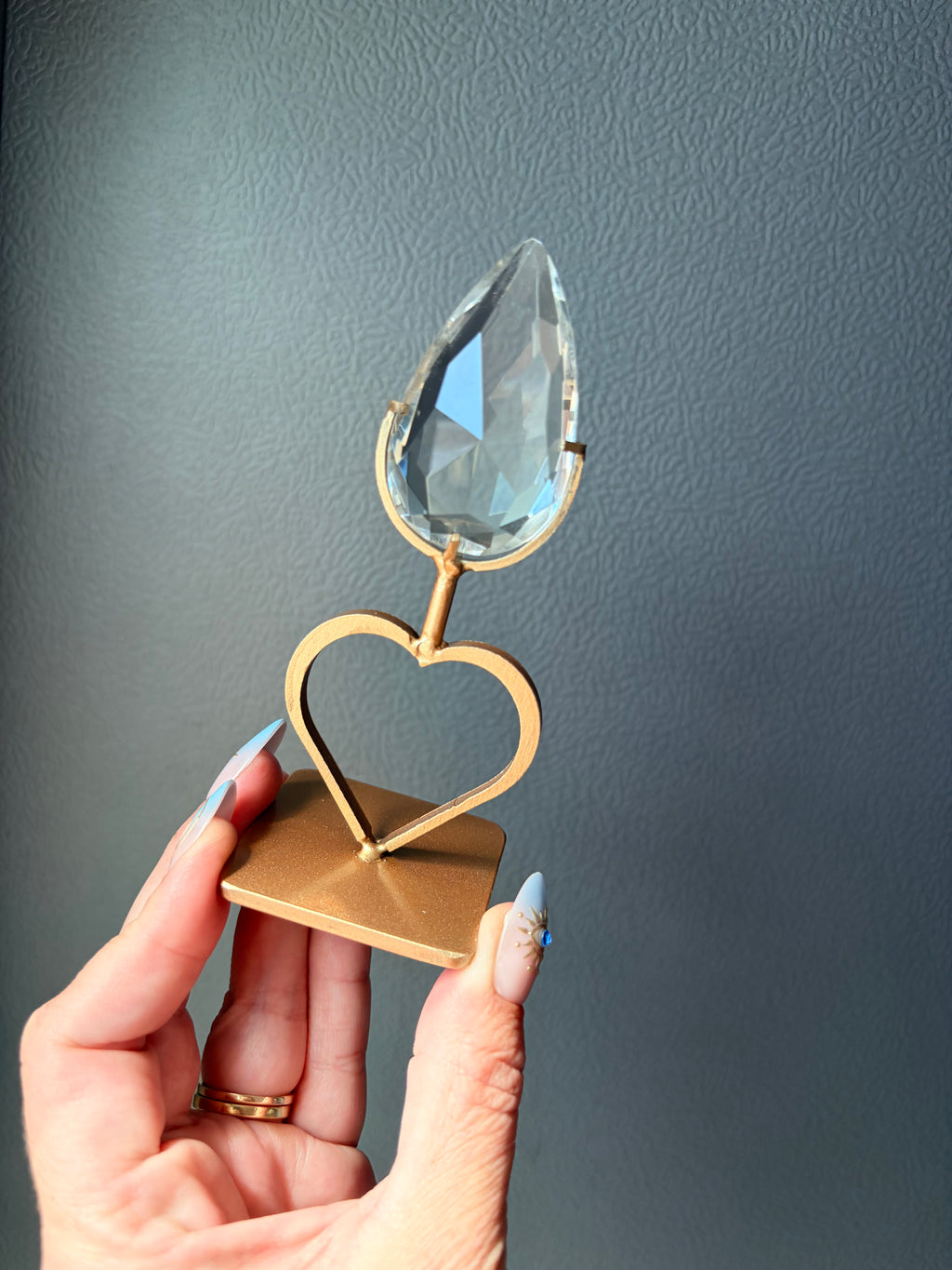 Faceted Clear Quartz Crystal on Heart Gold Stand