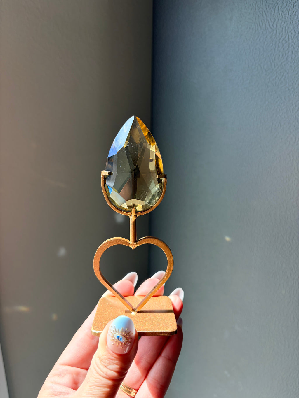 Faceted Citrine Gem on Heart Gold Stand