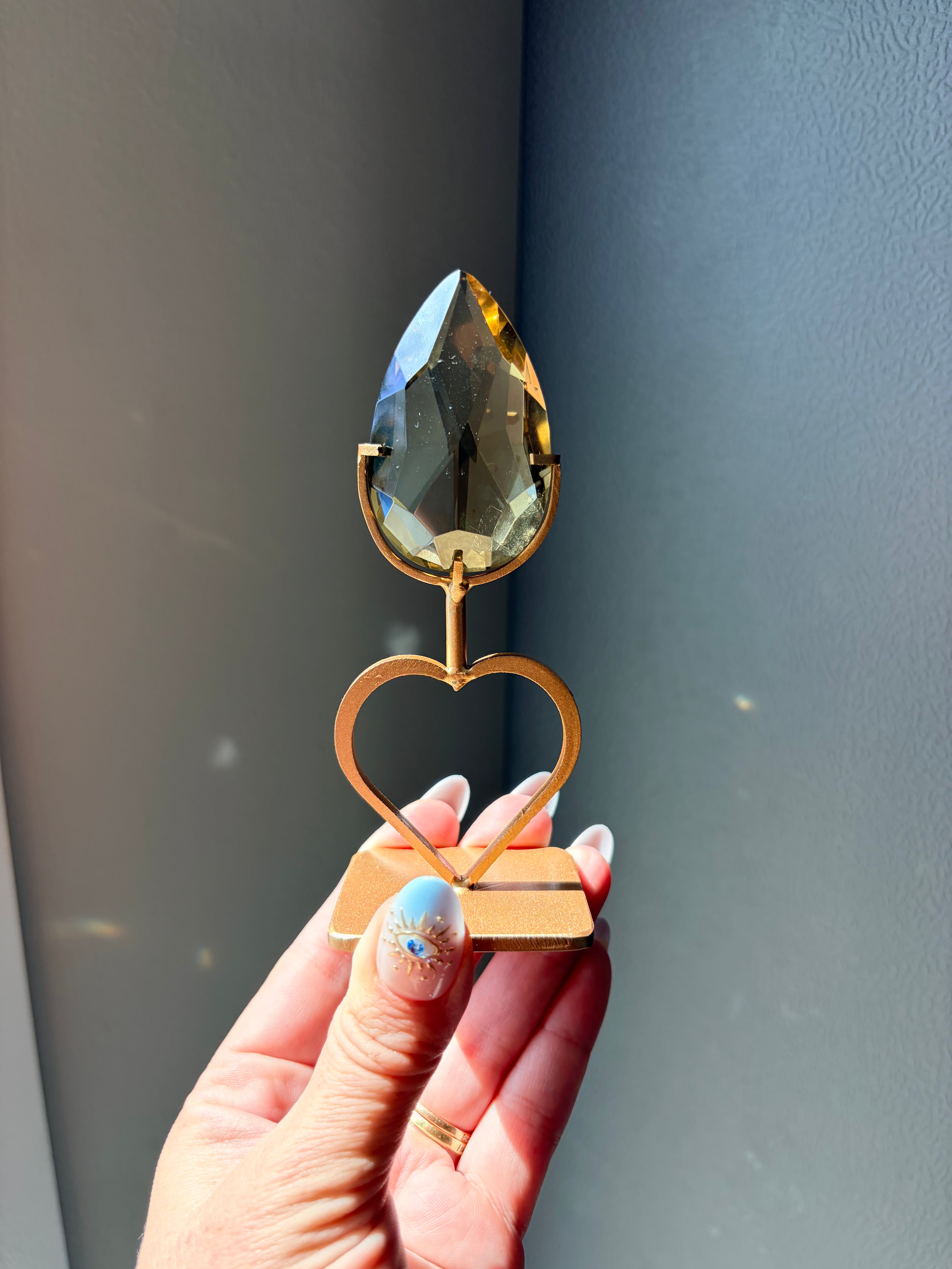 Faceted Citrine Gem on Heart Gold Stand