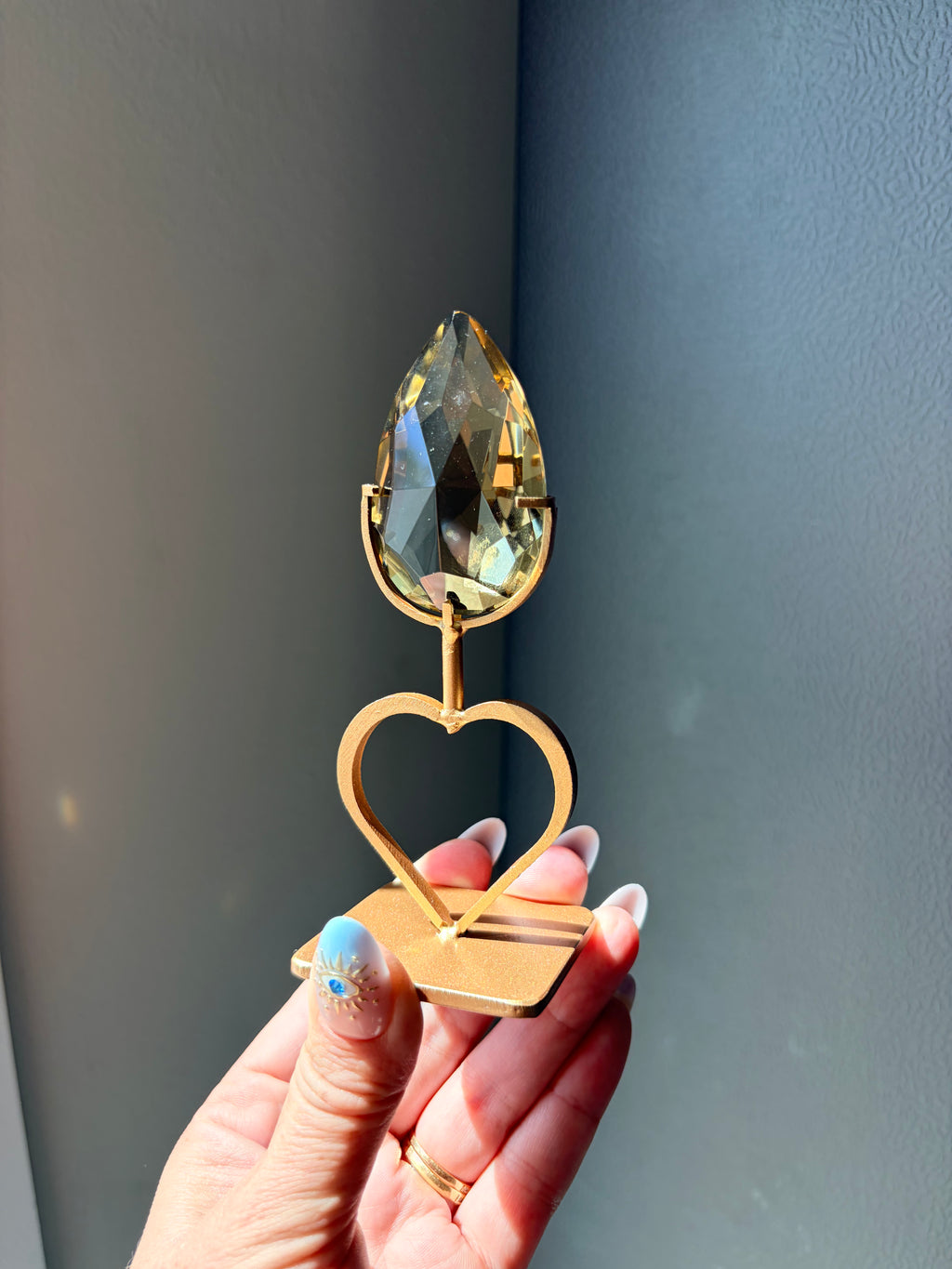 Faceted Citrine Gem on Heart Gold Stand