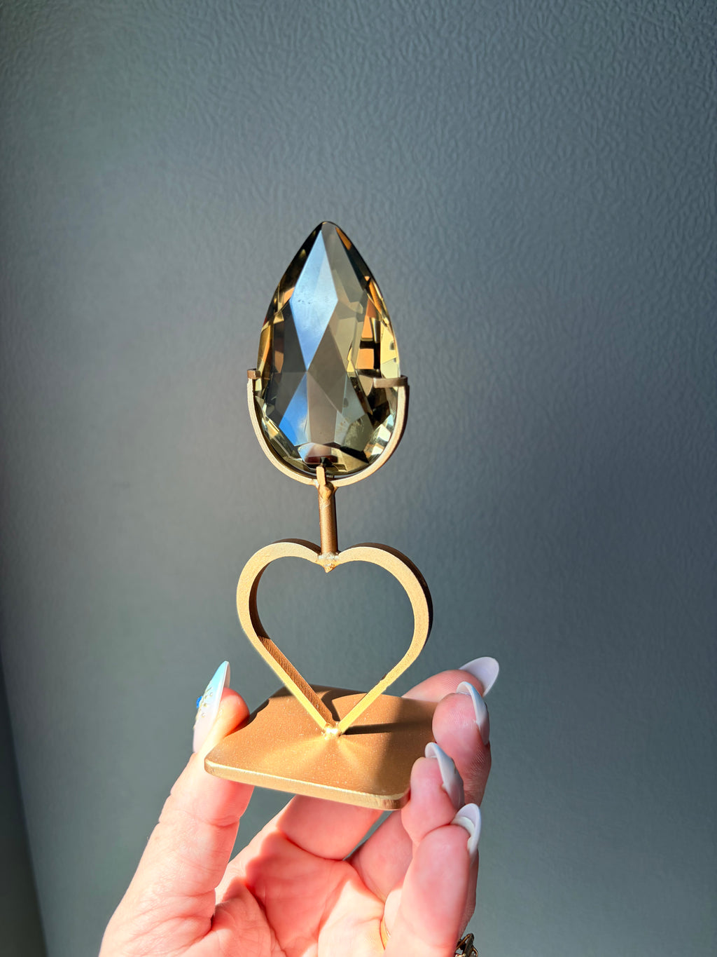 Faceted Citrine Gem on Heart Gold Stand