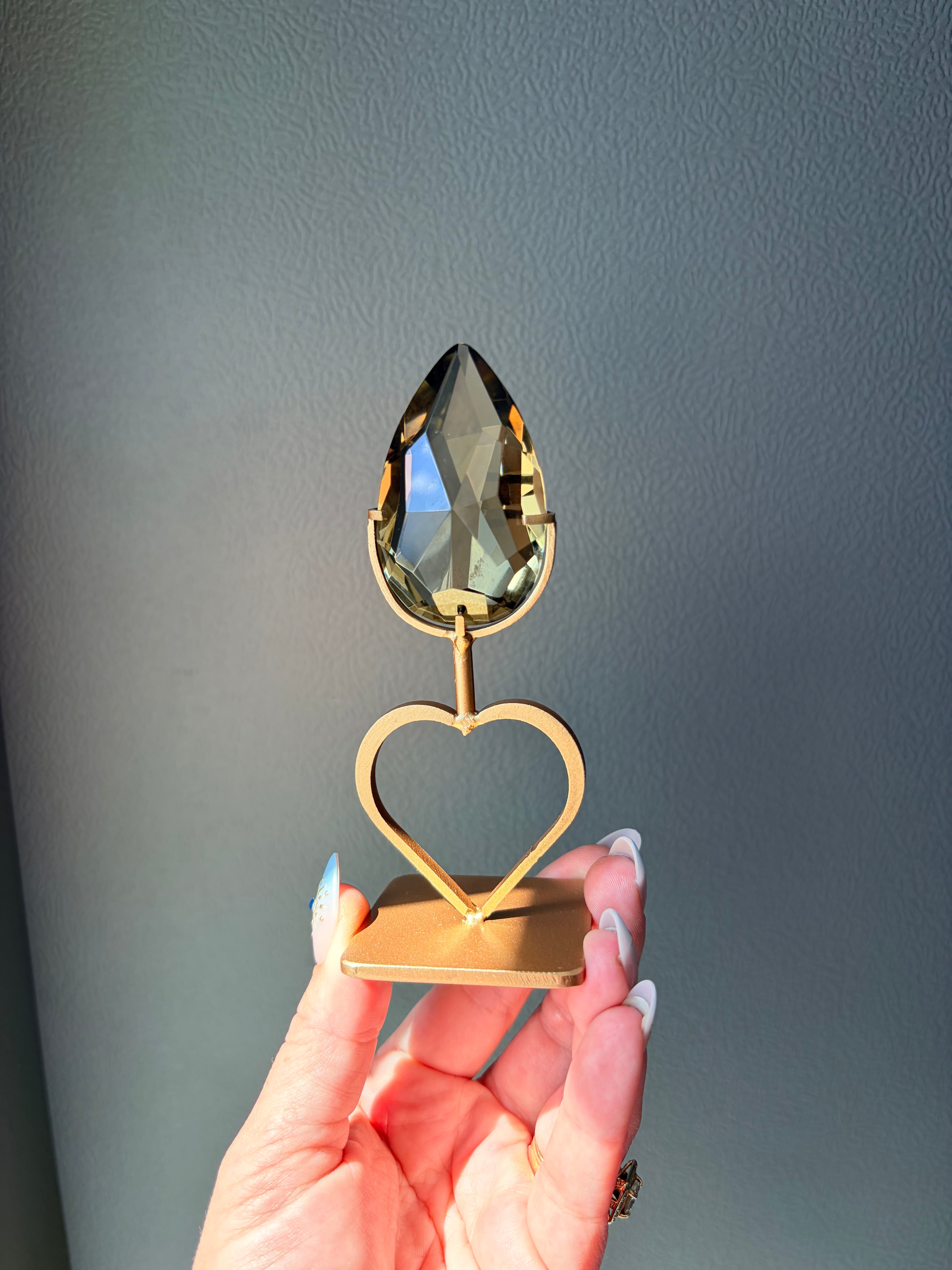 Faceted Citrine Gem on Heart Gold Stand