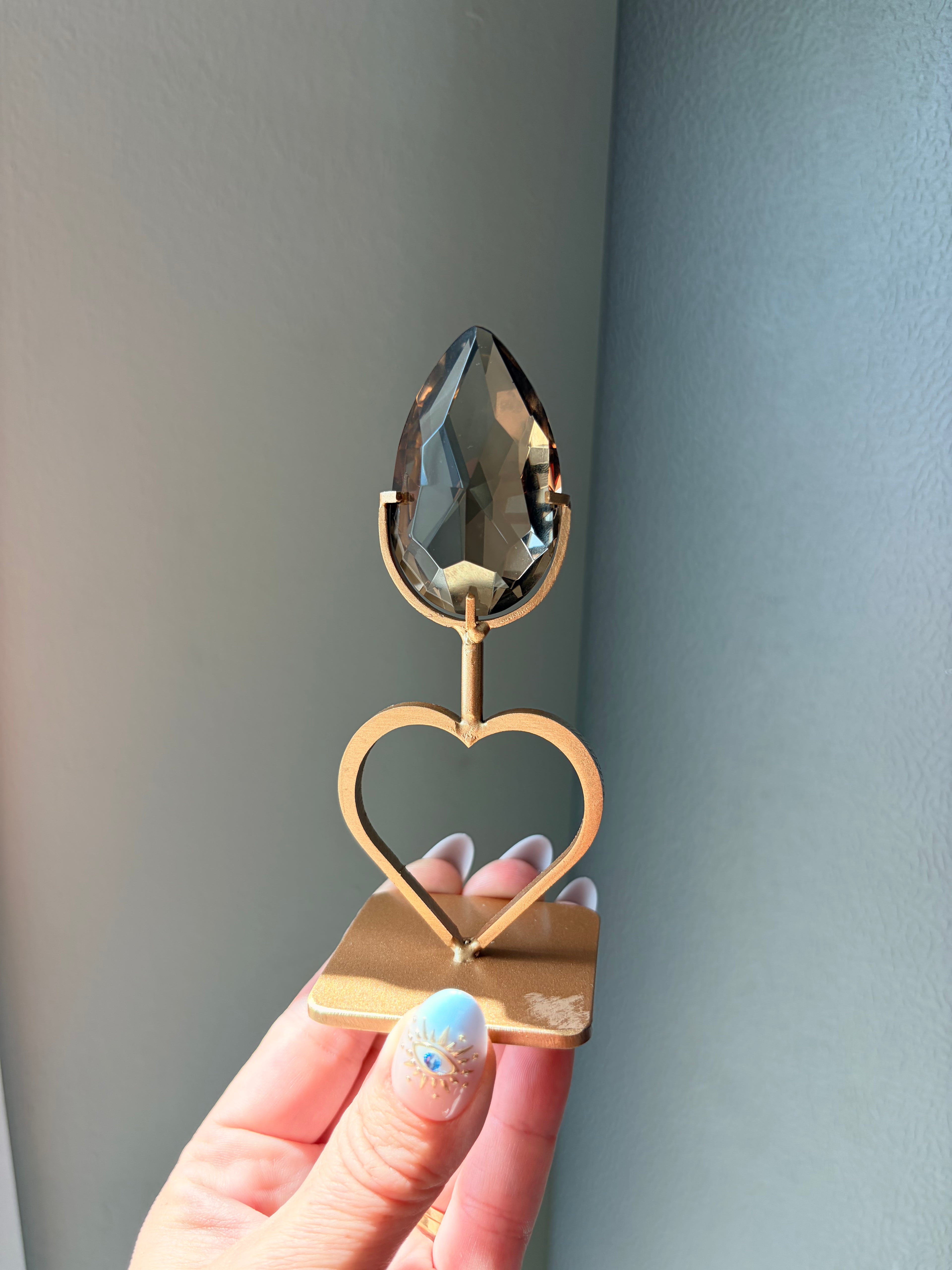 Faceted Smoky Quartz Gem on Heart Gold Stand