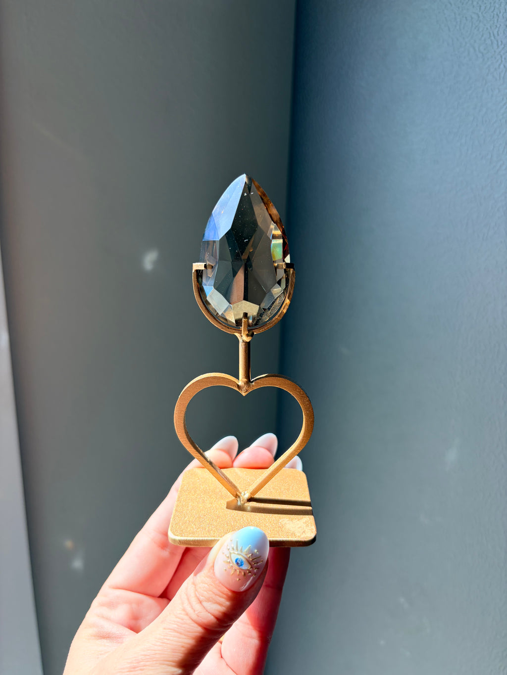 Faceted Smoky Quartz Gem on Heart Gold Stand