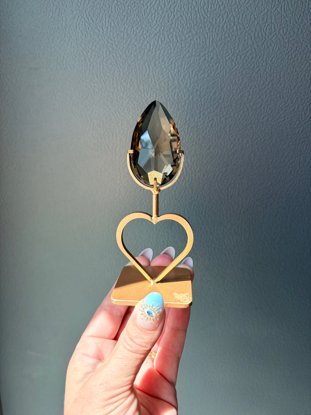 Faceted Smoky Quartz Gem on Heart Gold Stand
