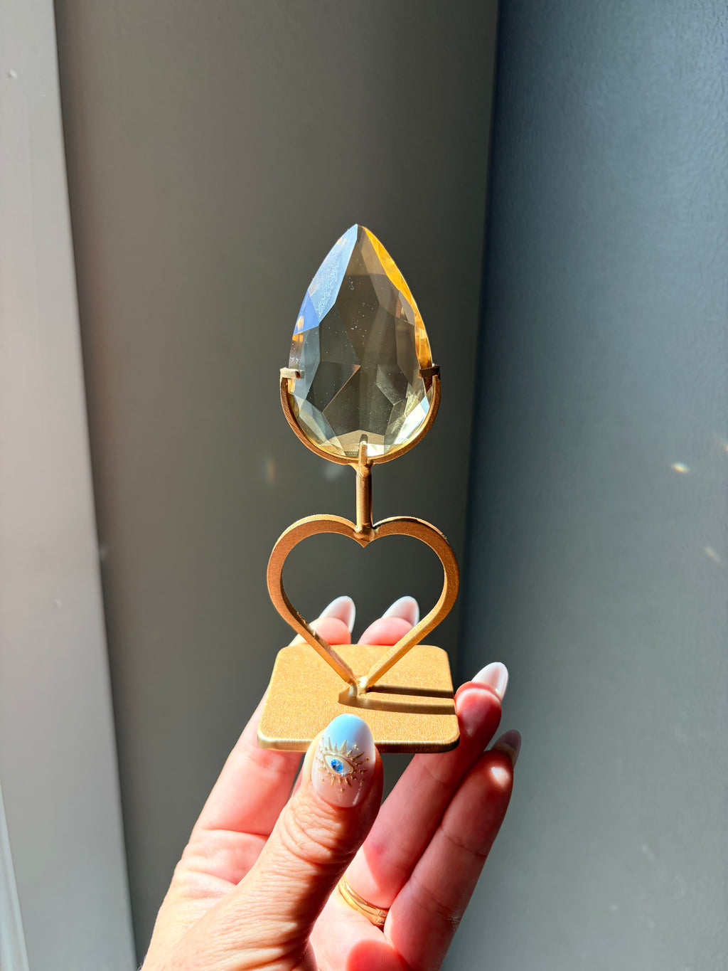 Faceted Citrine Gem on Heart Gold Stand