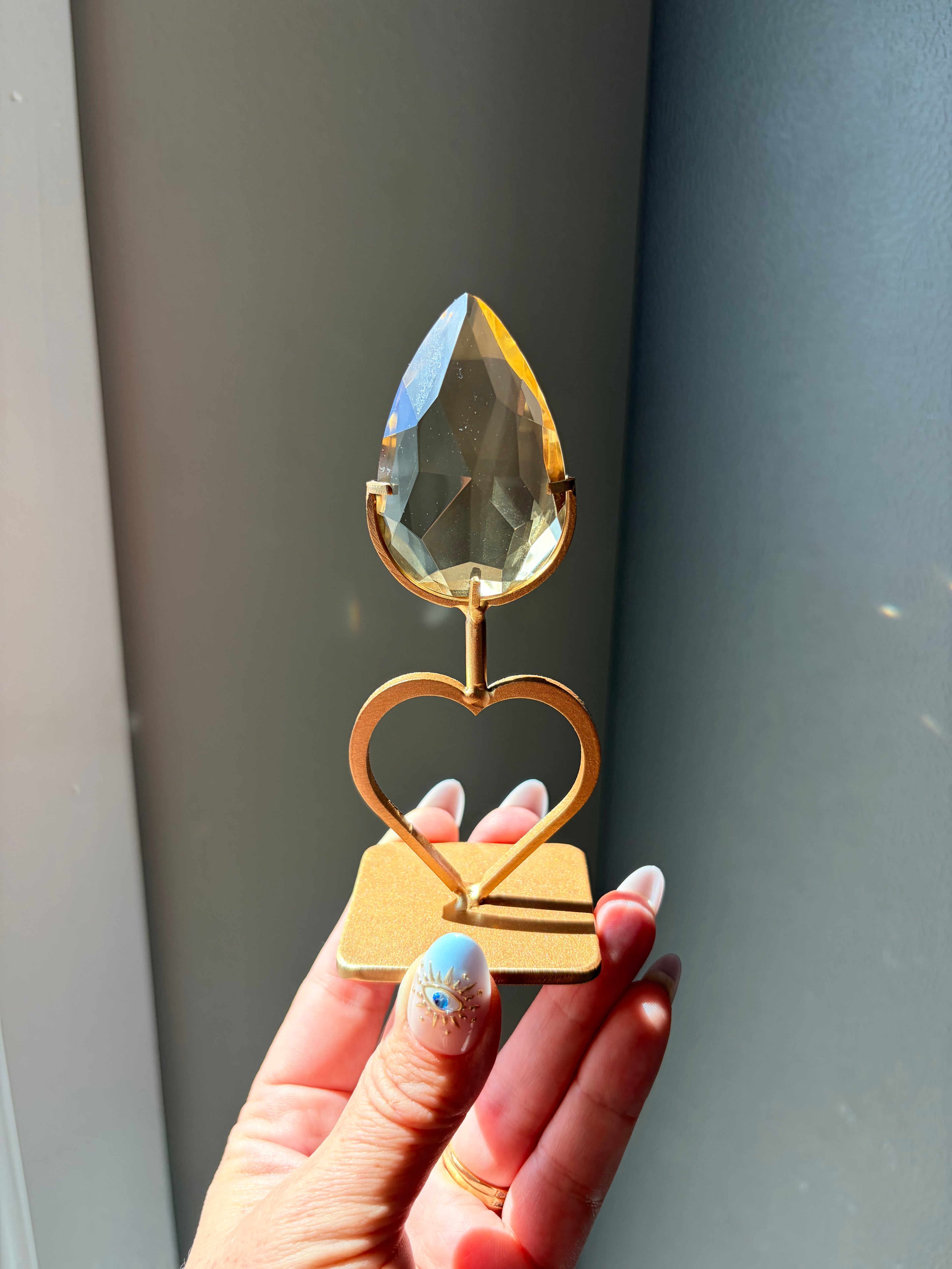 Faceted Citrine Gem on Heart Gold Stand
