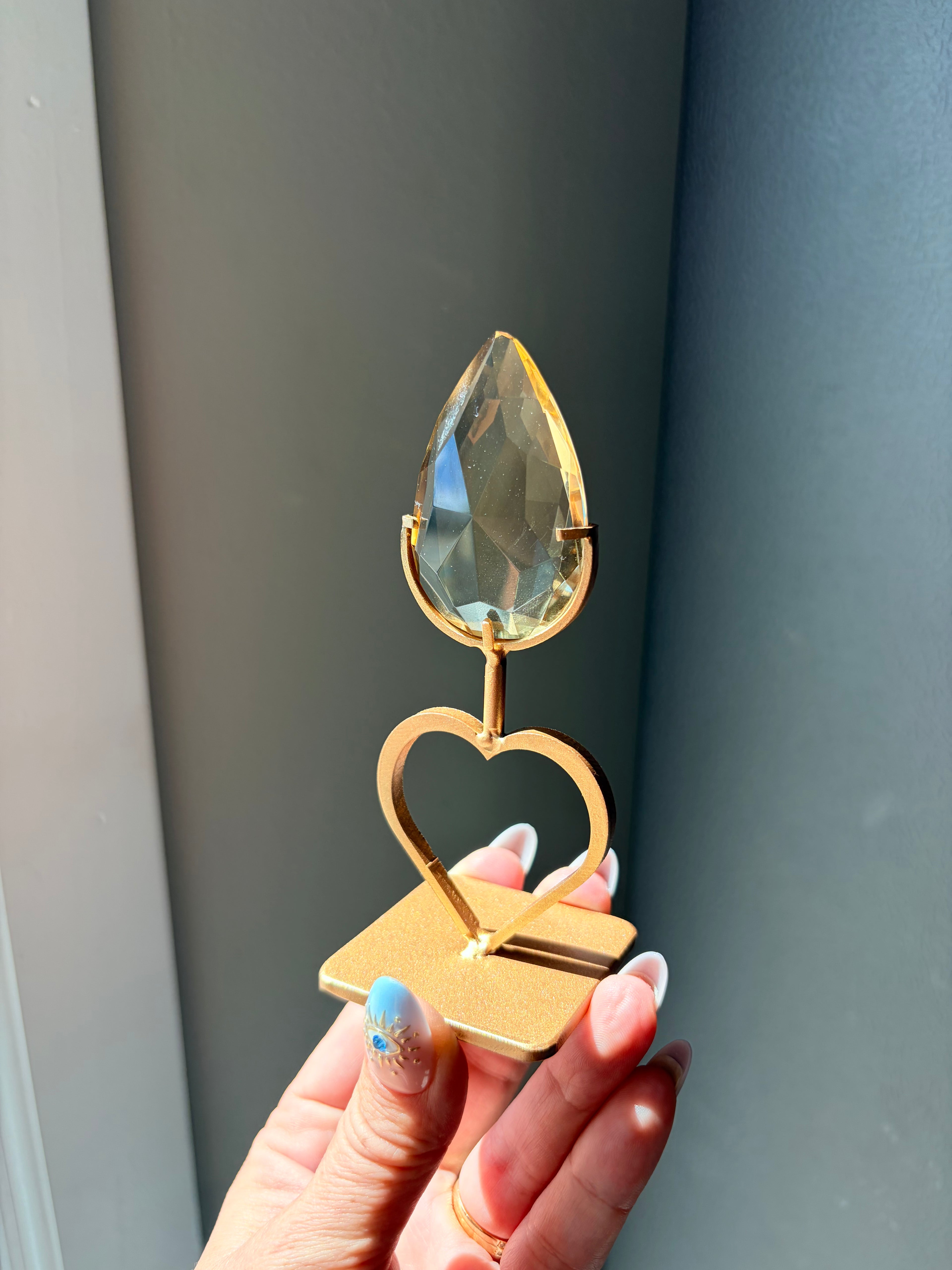 Faceted Citrine Gem on Heart Gold Stand