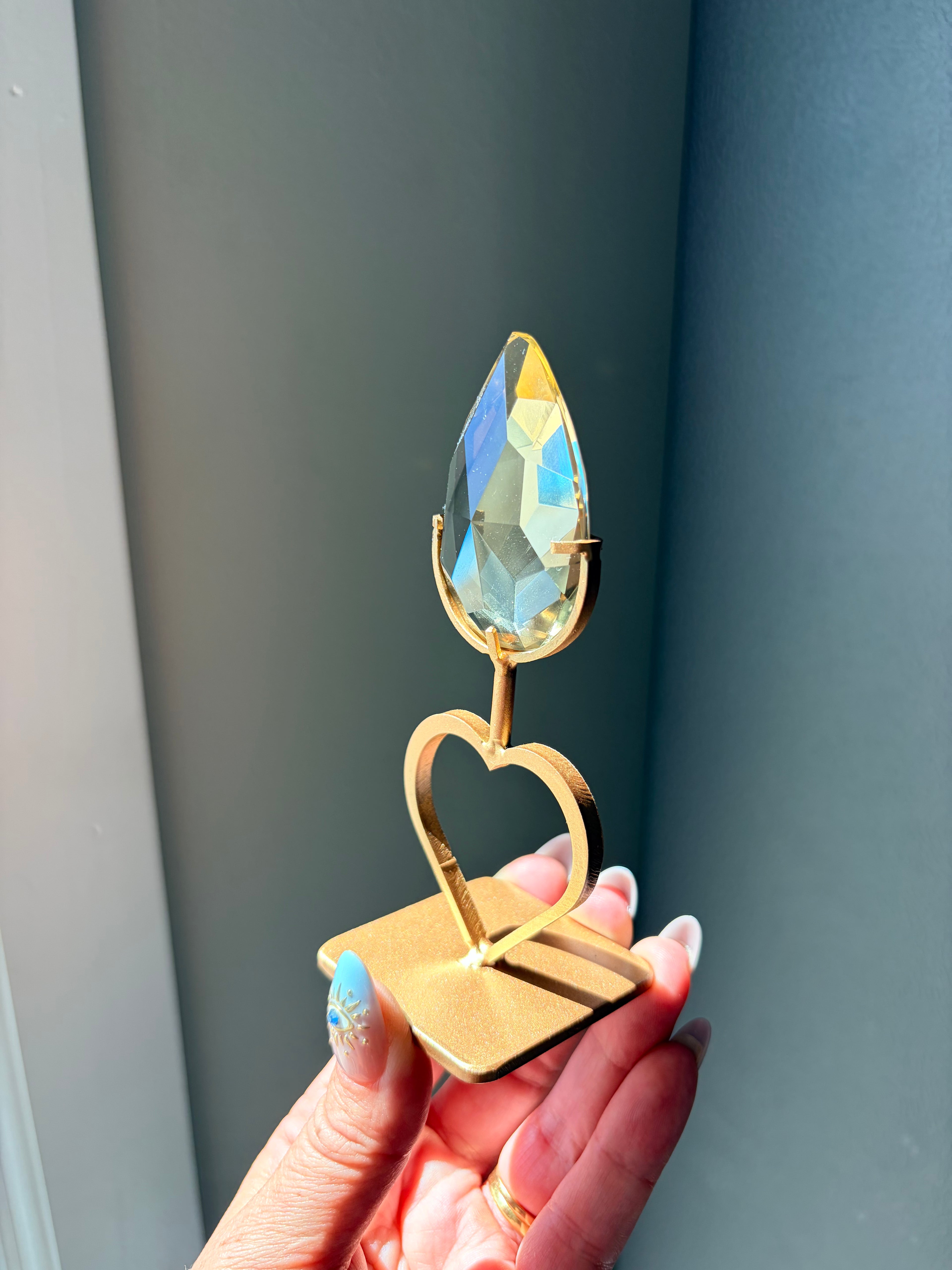 Faceted Citrine Gem on Heart Gold Stand