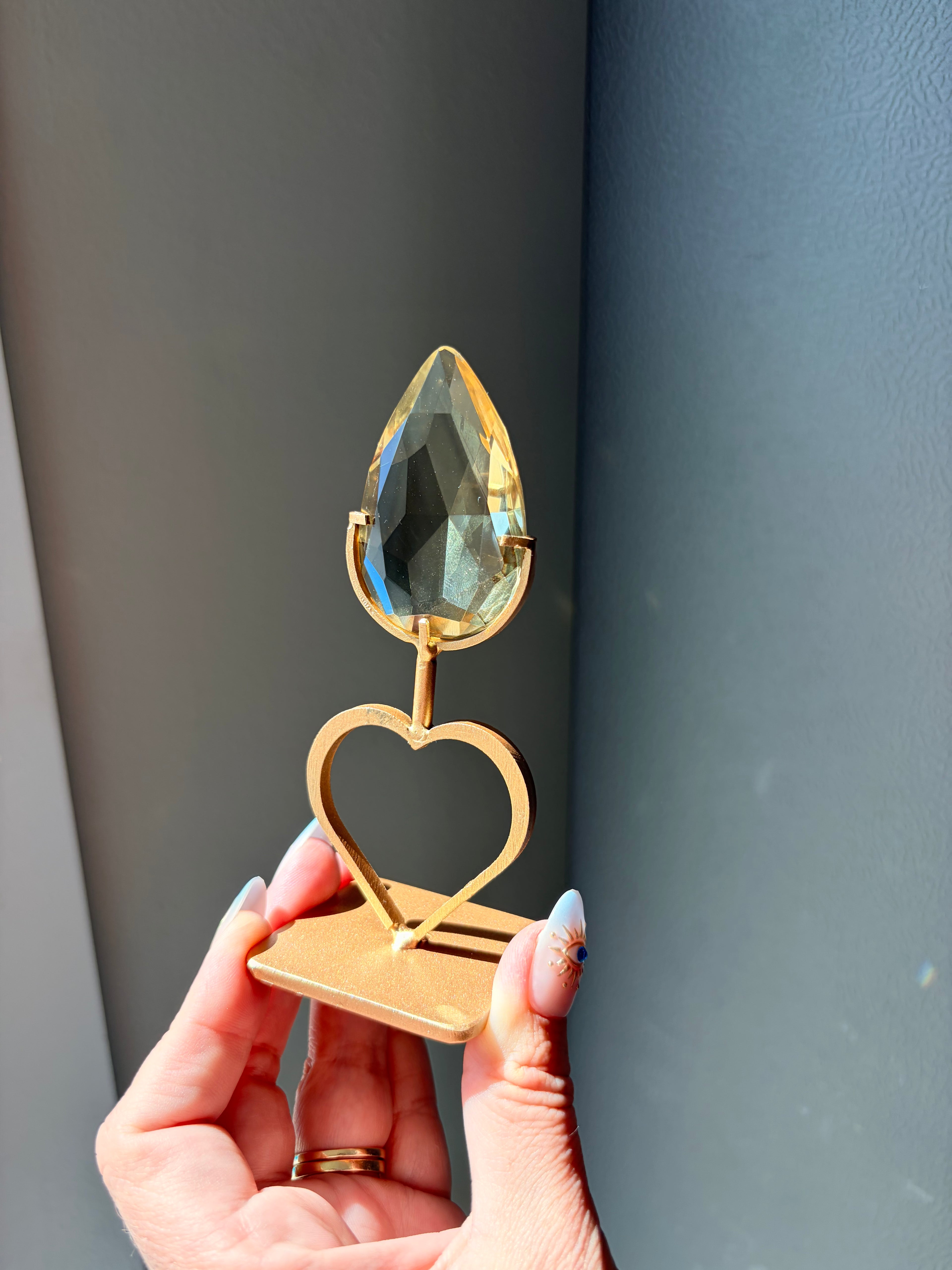 Faceted Citrine Gem on Heart Gold Stand