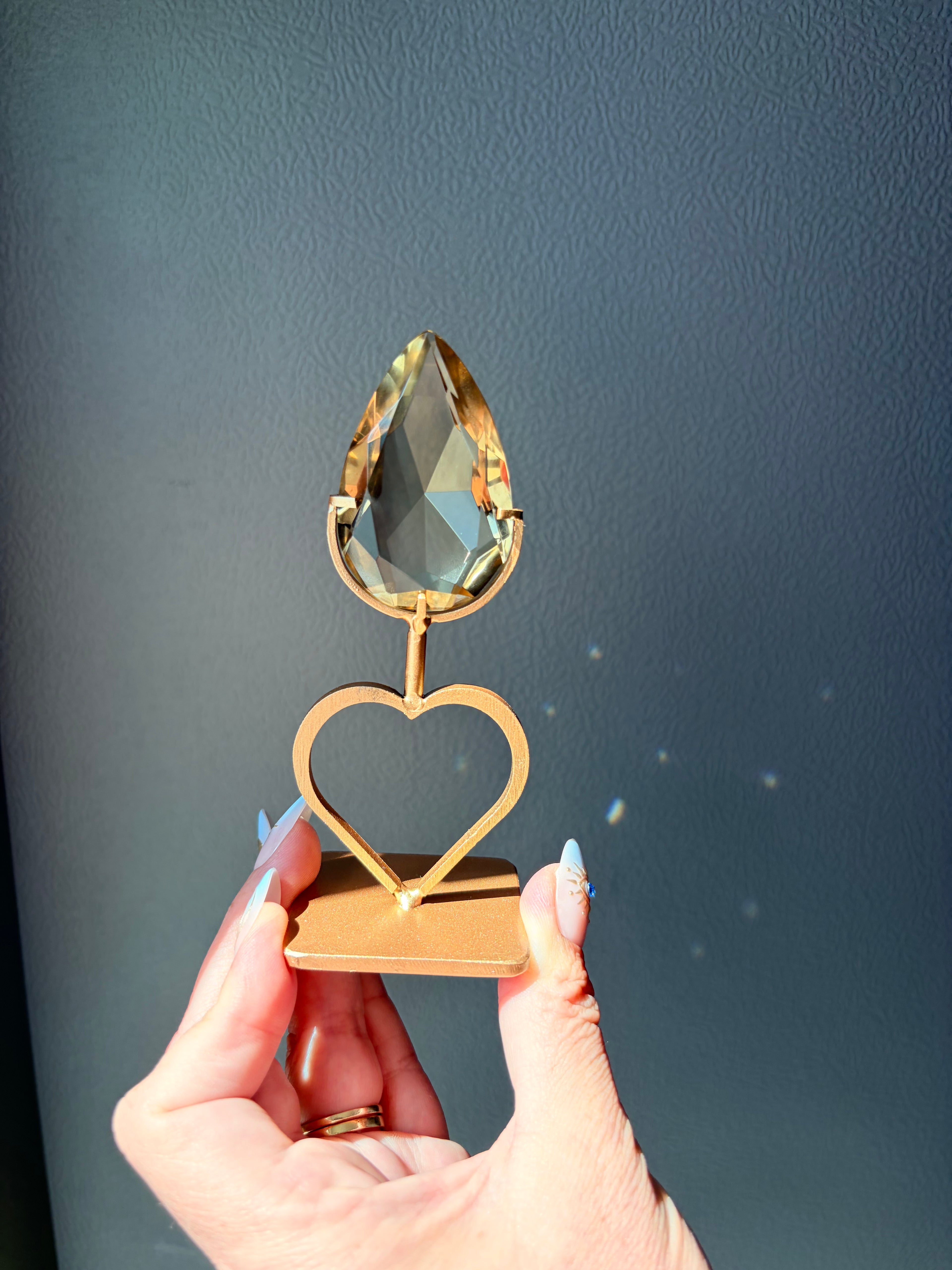 Faceted Citrine Gem on Heart Gold Stand