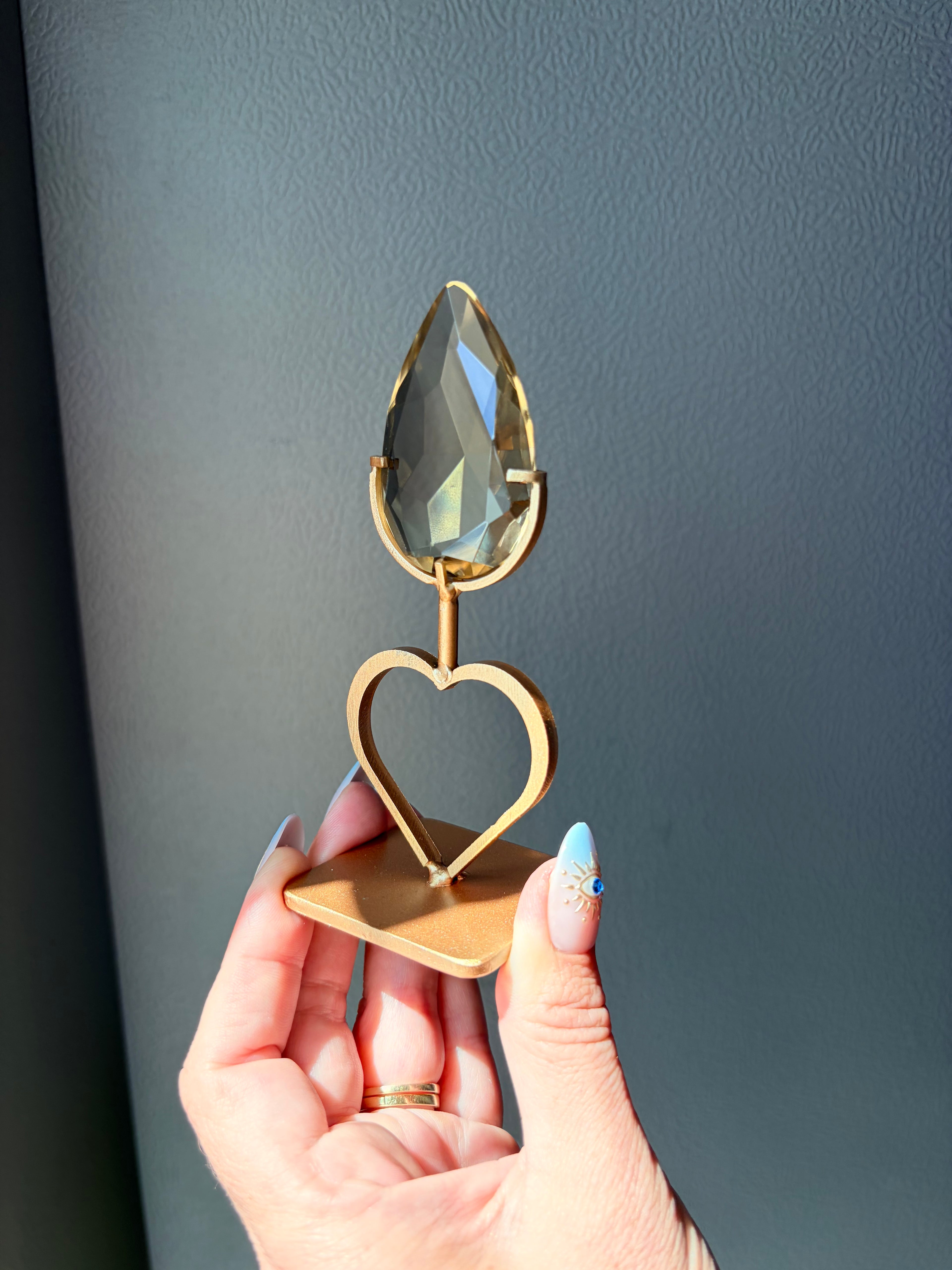 Faceted Citrine Gem on Heart Gold Stand