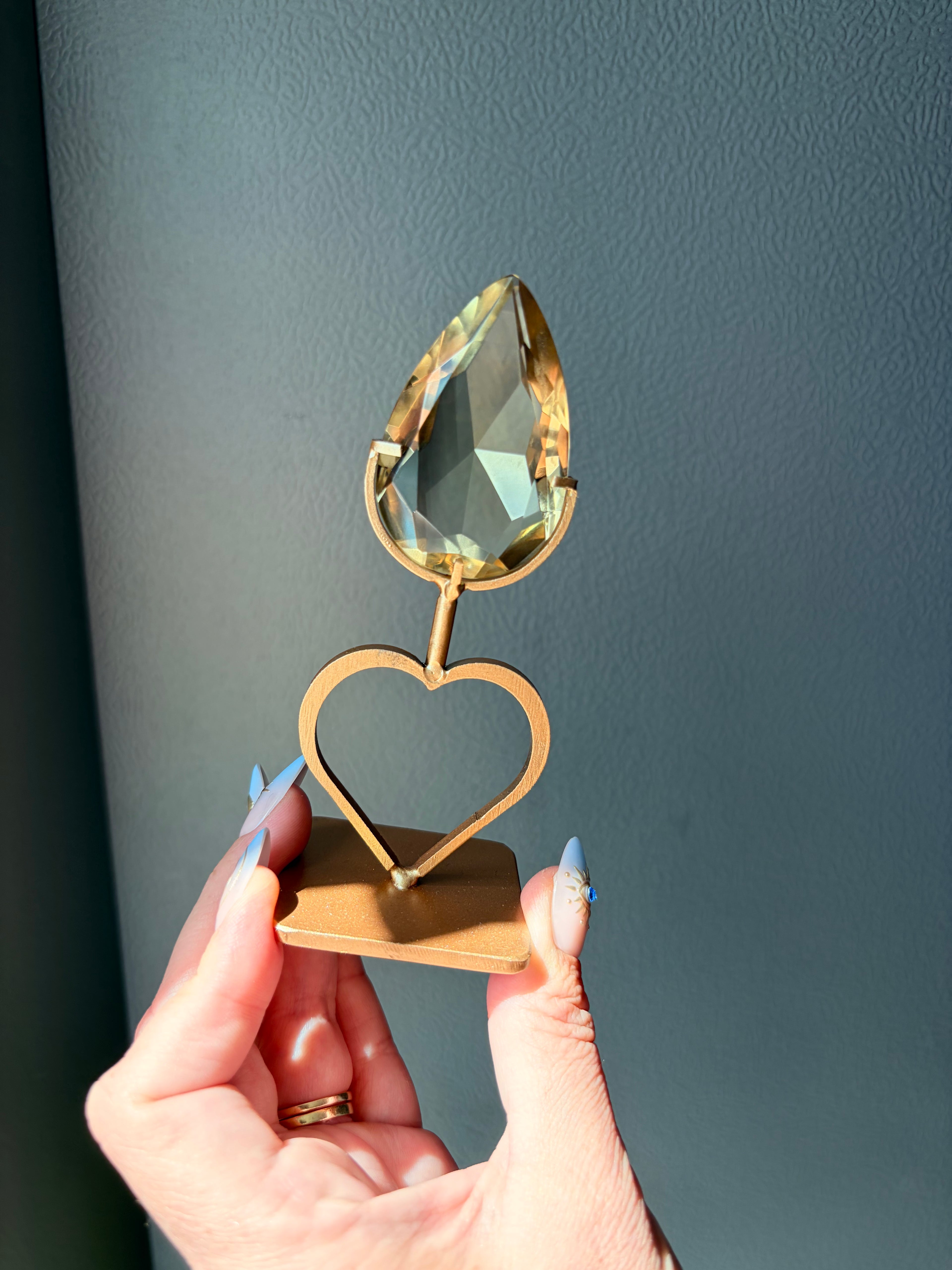 Faceted Citrine Gem on Heart Gold Stand