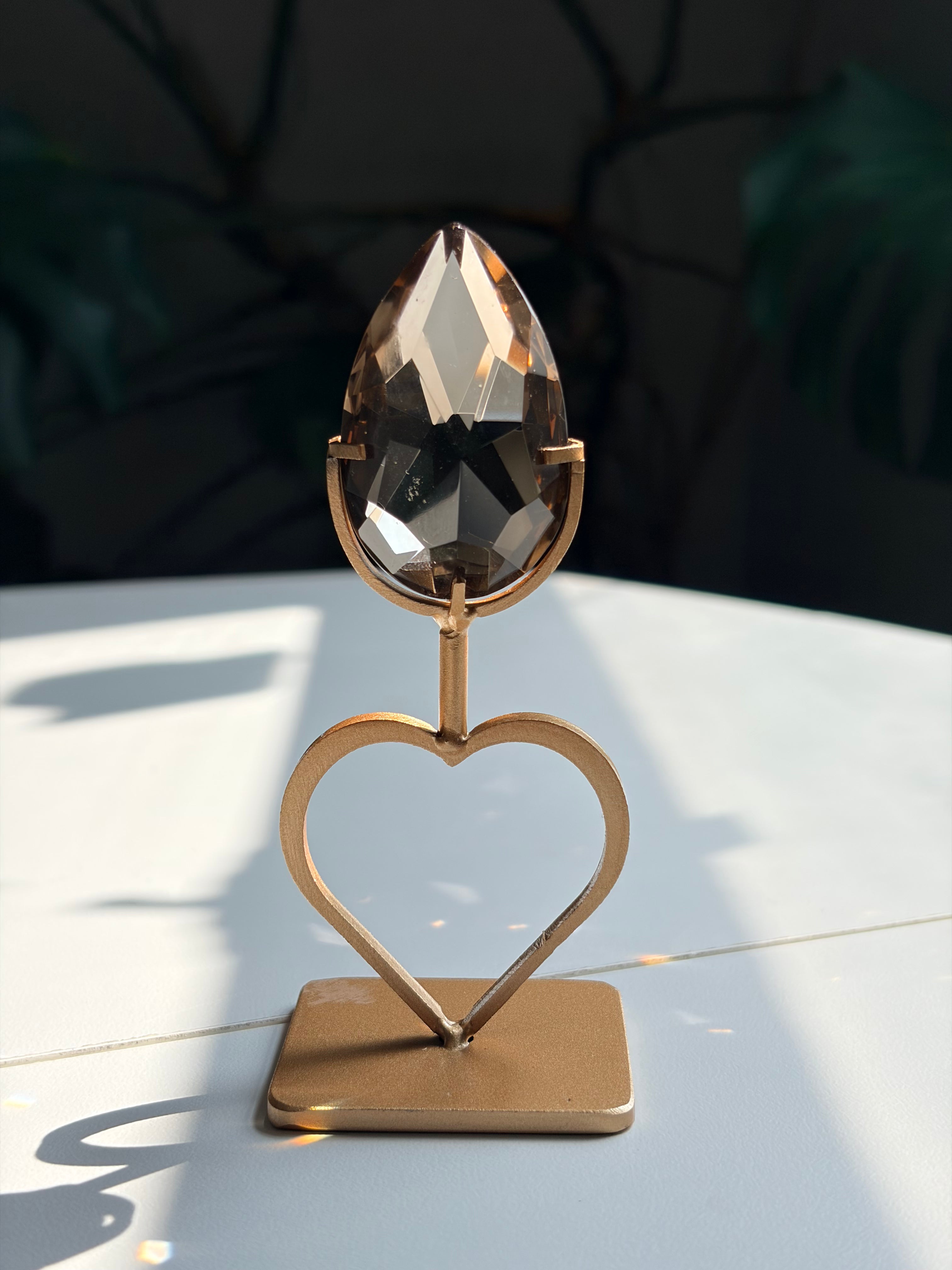 Faceted Smoky Quartz Gem on Heart Gold Stand